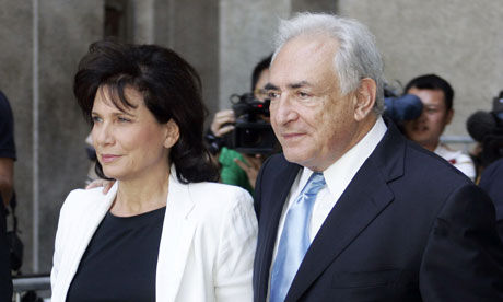 DSK leaving court with his long-suffering/supportive wife